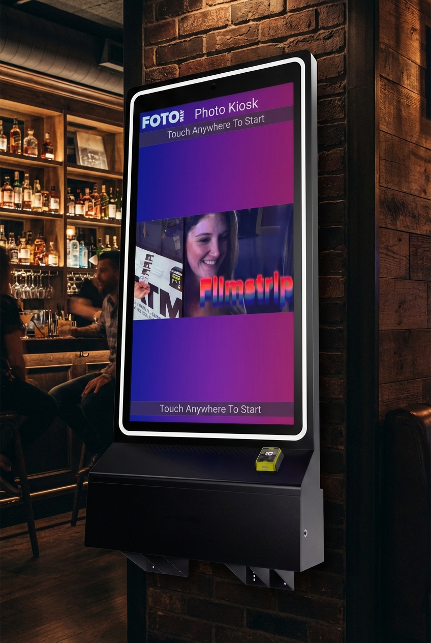 FotoATM Velo installed in an upscale bar with patrons — full kiosk view with FotoATM software running