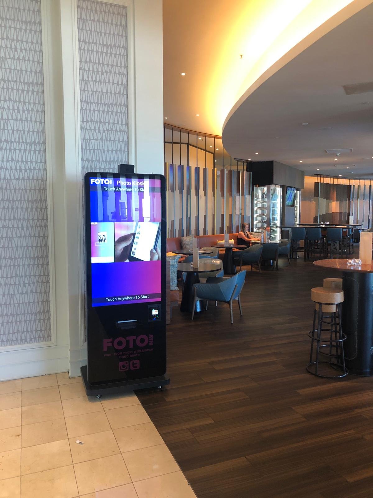 FotoATM Vista kiosk in an upscale hotel restaurant lobby